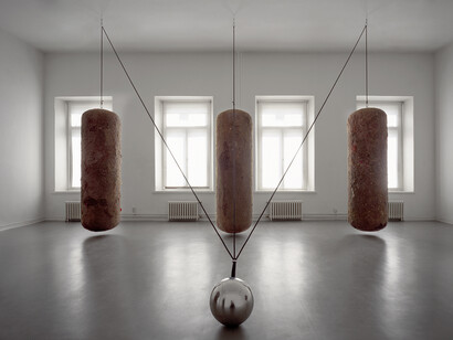 Timo Heino,Gravitation, 1999, House dust, rubber, stainless steel, lead shots, steel ball Ø 30 cm, three dust bales, 210 cm x 60 cm each