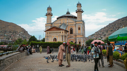 Tourists taking a selfie in front of the Shah-Do Shamshira Mosque in Kabul, Afghanistan