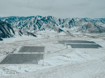 Solar farms on top of the mountains collect energy from the sun