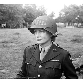 Lee Miller in steel helmet specially designed for using a camera, Normandy, France 1944 by unknown photographer Photographer Unknown © The Penrose Collection, England 2015. All rights reserved
