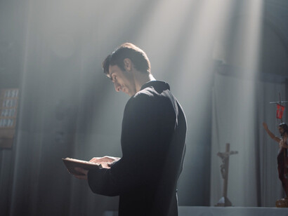 Amidst the grandeur of the cathedral, the Bible reflects both light and shadow, a symbol of faith manipulated for economic and political gain