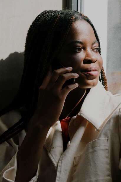 A woman using her mobile phone to call someone