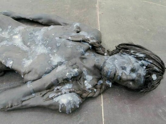 Andra Ursuta, Crush (detail), 2011, Cast urethane, wax, sneakers, wig, silicone. 60 x 40 x 9 in. (152 x 102 x 23 cm). Courtesy of the artist and Ramiken Crucible, New York.