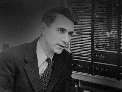 Claude Shannon a pioneer in the works of quantum information is answering questions from a reporter inside his lab