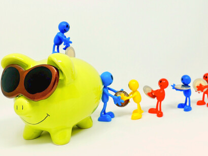 Putting money in a piggy bank