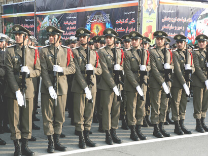 Military parade in Tehran, Iran, featuring ceremonial troops marching during an official state event