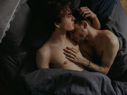 A loving couple sharing a tender moment in bed