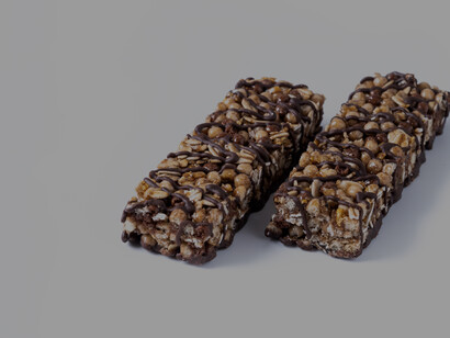 Healthy muesli and protein bars with nuts and seeds, presented in a close-up and flat lay style highlighting natural ingredients