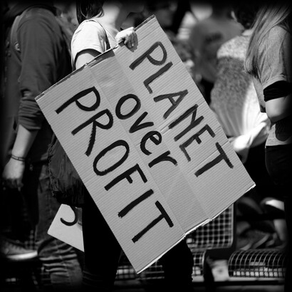 Placards condemning politicians' lack of interest in addressing climate change