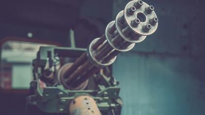A machine gun facing the observer is a symbol of misallocation of the world's resources 