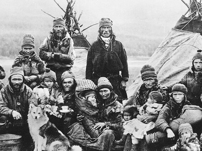 Nordic Sami (Saami) people in Sapmi (Lapland) in front of two Lavvo Tents. The Sami people in the photo are Nomads. Norway Sweden