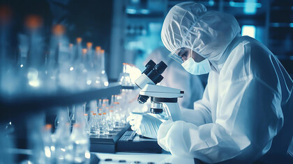 A scientist working in the lab develops pharmaceutical solutions