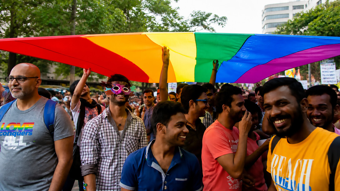 Members and supporters of the lesbian, gay, bisexual, and transgender community, some wearing masks, participate in a Pride March rally in Bangalore, India, on Sunday, November 22, 2015