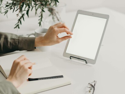 A tablet and notepad are key tools for any member in a startup