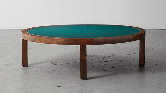 Joaquim Tenreiro, Round coffee table in jacaranda with a green glass top. Custom made for an estate in Sao Paulo, Brazil. Acquired from the original owner. Designed by Joaquim Tenreiro (1906-1992), Brazil, 1969. 11.5" H x 39" D. Photo: Sherry Griffin © Joaquim Tenreiro. Courtesy: Sean Kelly, New York with R & Company, New York