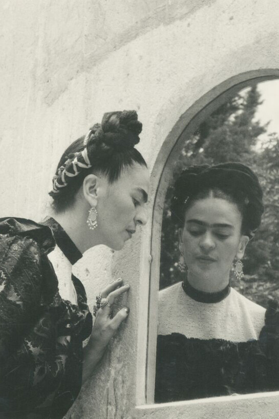 Lola Alvarez Bravo. "Frida Looking Into Mirror With Dogs," c. 1944. Courtesy of Throckmorton Fine Art
