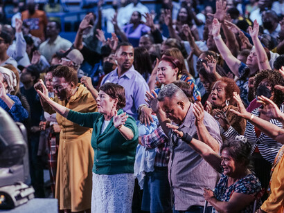 A congregation gathered in a church, illustrating how faith remains a collective experience within modern society