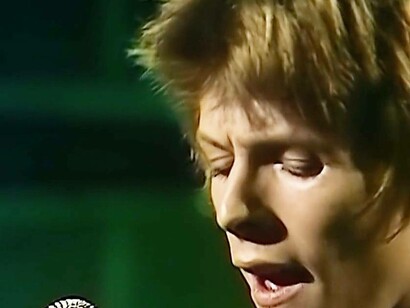 David Bowie digging deep to belt out a classic hit from his collection in the 1970s