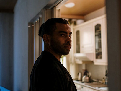 Anxious man with OCD in the kitchen, struggling with intrusive thoughts, compulsions, and rituals