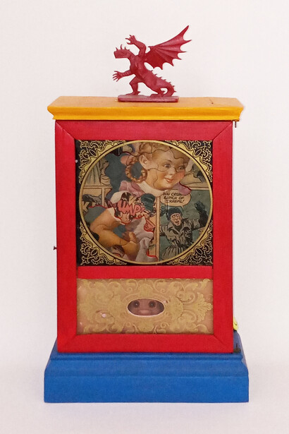 May DeViney, Child’s Play (You Crummy Bunch of Creeps)”, 14x7x3.25 inches; antique clock case, puzzle pieces, collage from comic books, metal and plastic toys. Courtesy of the artist and Viridian Artists Inc.