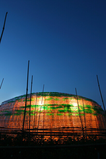 At dusk, the Bottle Sail in Haiphong, Vietnam, takes on a sculptural presence, 3,000 plastic bottles transformed into a beacon of sustainable innovation