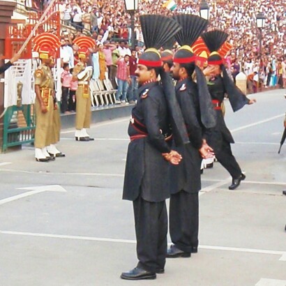 Crowds watch in national pride as border troops engage in their daily drill—yet behind the pageantry lies growing public unease over the recent violence in Kashmir