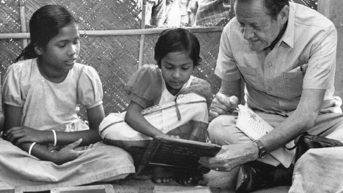 Jim Grant teaches two young girls