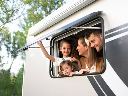 A family making lasting memories while having fun together in their tiny van house during an adventurous road trip
