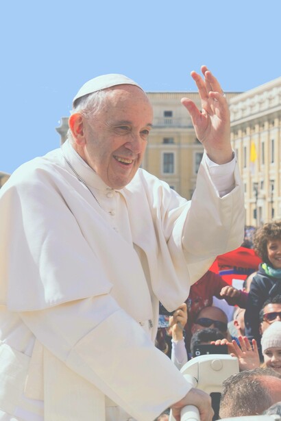 Pope Francis smiles while addressing his audience in Vatican City