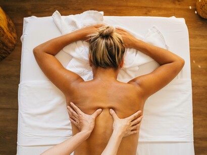 A woman healing by receiving a massage