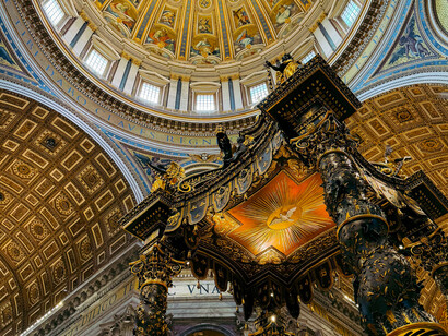 Bernini's magnificent Baldachin dominates the high altar of St. Peter's Basilica in Vatican City, surrounded by ornate Baroque architecture, historic frescoes, and richly detailed religious artwor