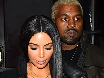 Kim Kardashian looks solemn as Kanye West appears dazed 
