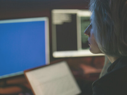 Woman typing on keyboard, working with technology, modern workspace