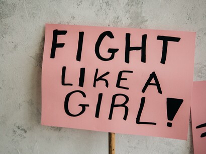 A protest sign that reads: Fight like a girl!