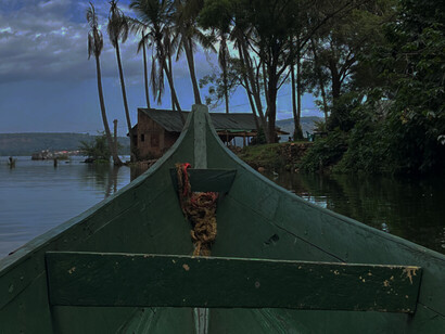 The edge of a green boat on the Jinja River, Uganda, East Africa