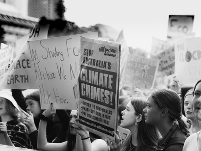 Monochrome image of participants holding placards during a climate change protest in Sydney, New South Wales, Australia