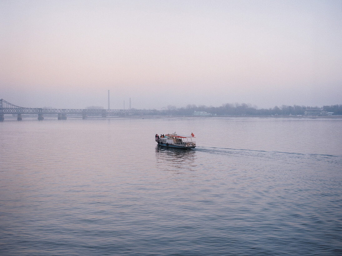 Tomoko Yoneda, from the series Scene, Wedding - View of the wedding party on the river that divides North Korea and China, Dandong, China 2007 © Tomoko Yoneda
