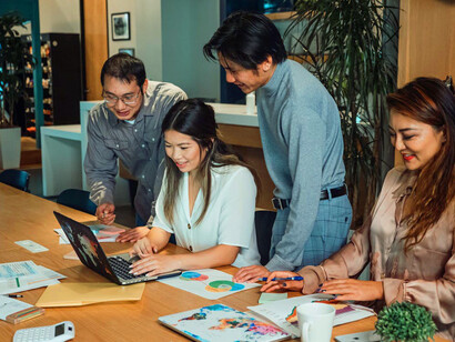 With engaged faces and enthusiastic discussions, this team exemplifies how a supportive atmosphere can alleviate the pressures of modern work life