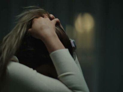 A woman consumed by fear, battling anxiety and depression in the darkness of night