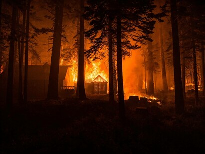 A home burns as the Caldor fire rips through the canyon along Highway 50 south of Lake Tahoe, in California, August 29, 2021 captured by Lynsey Addario