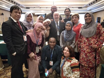 Writer with Perdana students and staff