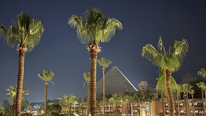 A captivating view of Egypt's iconic Giza Pyramids at night