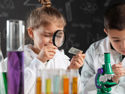 Children conducting experiments in a lab embody the foundation of scientific literacy, bridging science and society through research, development, and academic outreach