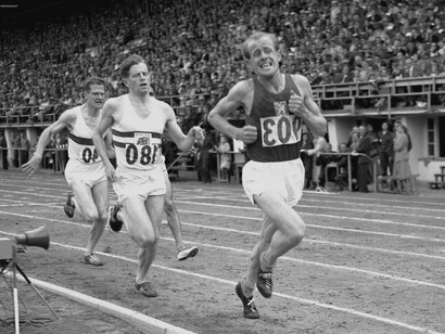 Emil Zátopek leading the 5000 meters race at the Helsinki Olympic Games