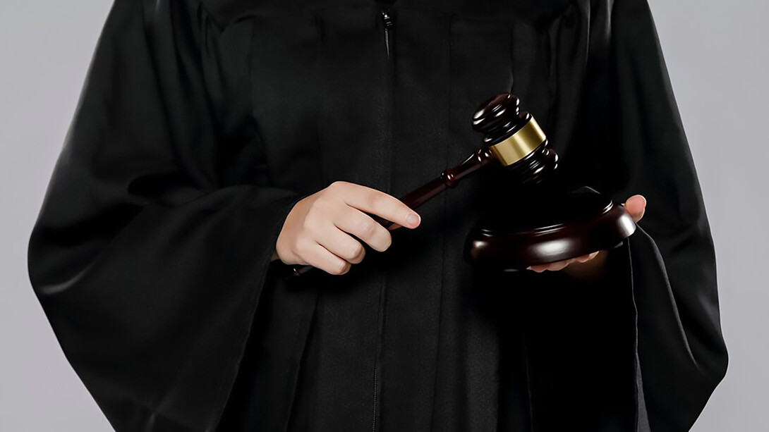 A female judge with gavel, symbolizing authority and justice