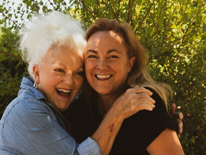 Elderly couple laughing: aging is a lifelong process of growing up and growing old