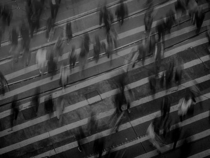 Time-lapse photography capturing people strolling along a pedestrian lane on Hong Kong Island