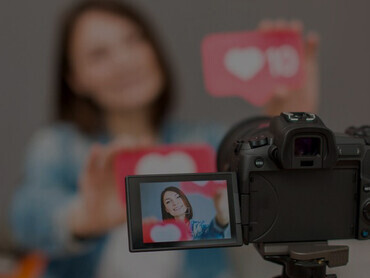 A thought-provoking portrait of a confident woman recording a video for social media, highlighting themes of media addiction, mixed media, and narcissism