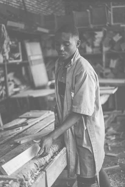 Young carpenter works diligently 