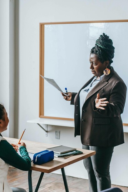 Teacher engaging student in Swahili class